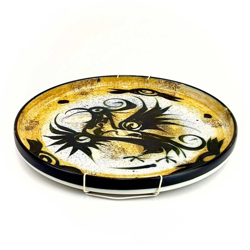 503 - A Celtic pottery tray. Decorated with a bird. Diameter 32.5cm.