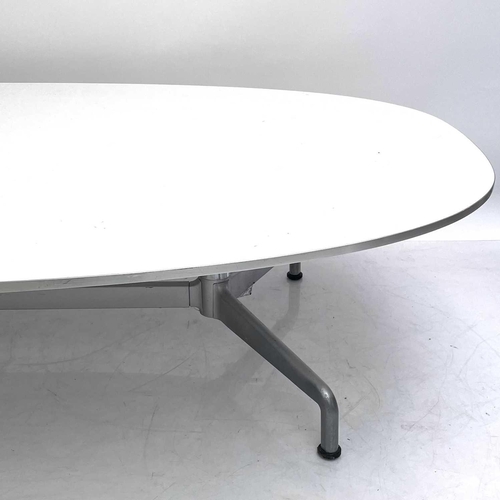 507 - Fritz Hansen, A Danish white laminate low elliptical table. 1980s, raised on a chrome and brushed al... 