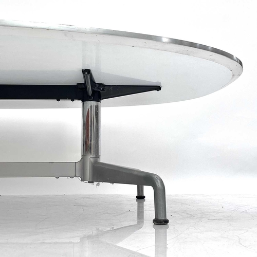 507 - Fritz Hansen, A Danish white laminate low elliptical table. 1980s, raised on a chrome and brushed al... 