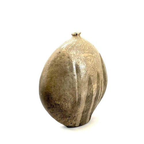 510 - Christa Maria HERRMANN (b.1945). A large Raku fired vase of flattened ovoid form, potter's label to ... 