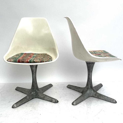 521 - An Arkana white laminate Tulip table and four chairs. 1960s, the chairs on aluminium supports, the o... 