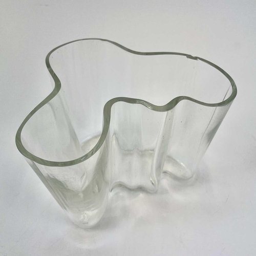 546 - A Littala Alvar Aalto clear glass vase. Signed to base height 16cm, together with a smaller white gl... 