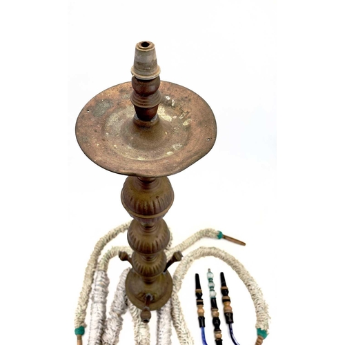 56 - A tall pierced Indian brass hookah. 20th century, with blue glass panels and three pipes, height 193... 