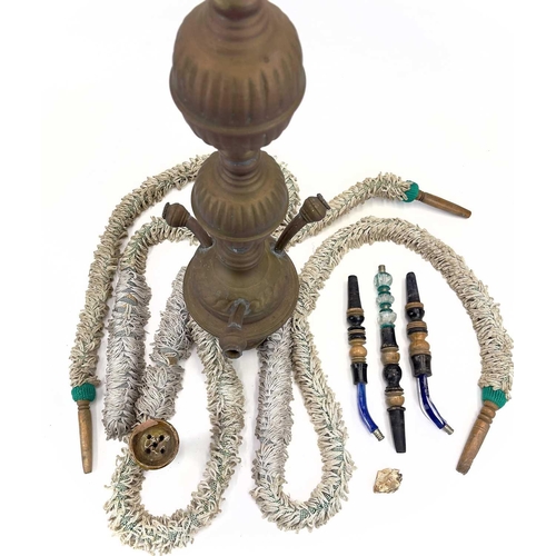 56 - A tall pierced Indian brass hookah. 20th century, with blue glass panels and three pipes, height 193... 