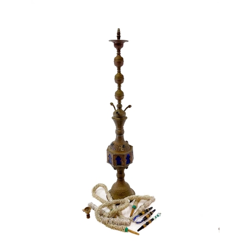 56 - A tall pierced Indian brass hookah. 20th century, with blue glass panels and three pipes, height 193... 