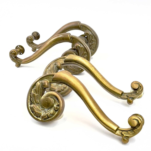 58 - Two pairs of brass theatre door handles. Circa 1900, with scrolled foliate terminals, height 30cm. T... 