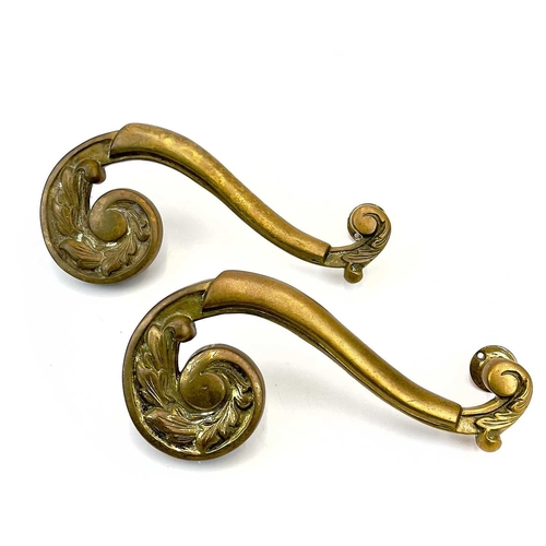 58 - Two pairs of brass theatre door handles. Circa 1900, with scrolled foliate terminals, height 30cm. T... 