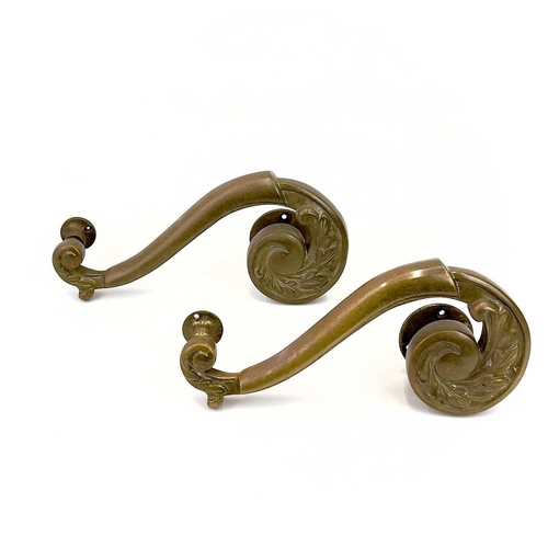 58 - Two pairs of brass theatre door handles. Circa 1900, with scrolled foliate terminals, height 30cm. T... 