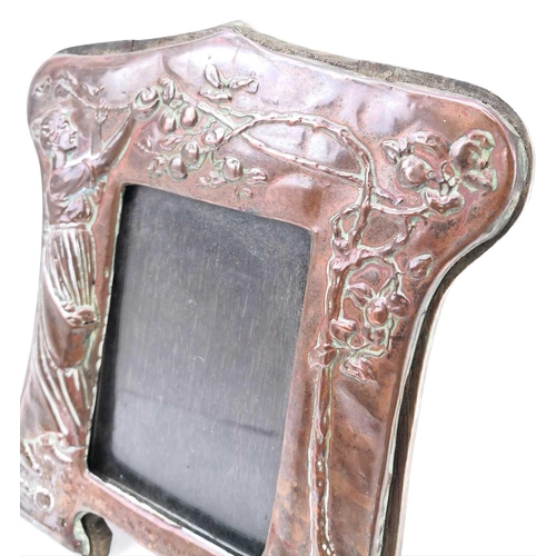 60 - An Art Nouveau copper picture frame with repousse decoration of a maiden picking apples. Stamped Cop... 