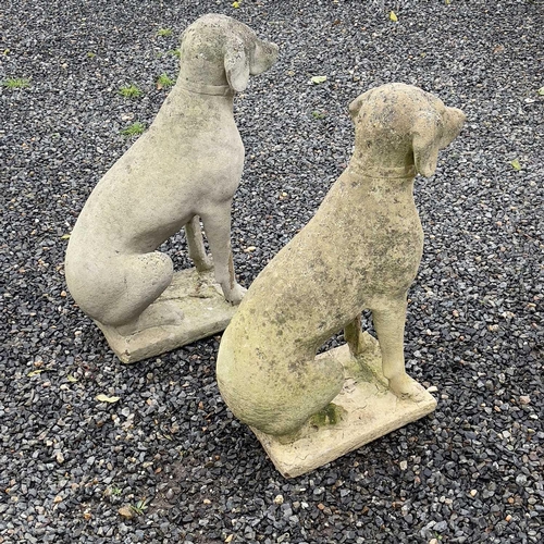 600 - A pair of reconstituted stone figures of Pointer type dogs. Height 73cm.