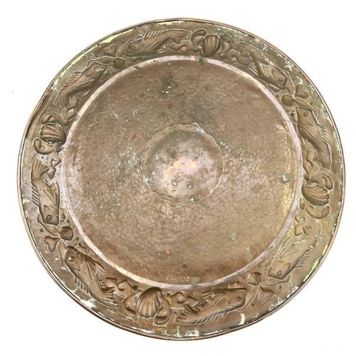 7 - A Newlyn circular copper tray. With pierced gallery and repousse decorated with a border of fish and... 