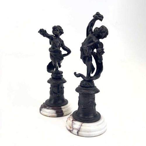 77 - A pair of bronze figures of cherubs. 20th century, with turned marble bases, height 19cm, together w... 