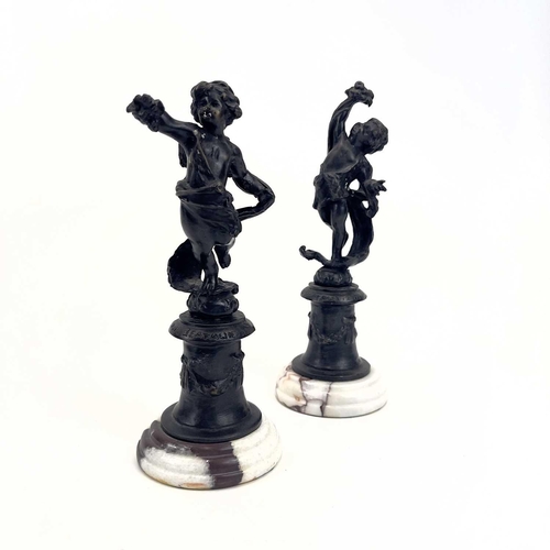 77 - A pair of bronze figures of cherubs. 20th century, with turned marble bases, height 19cm, together w... 