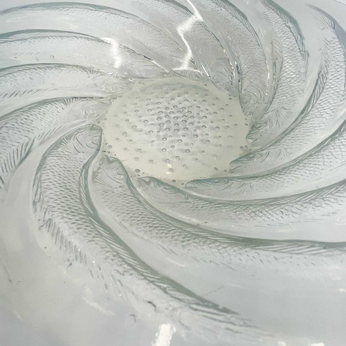 803 - A Lalique opalescent glass bowl, Poisson. The border moulded with fish, marked internally to the cen... 