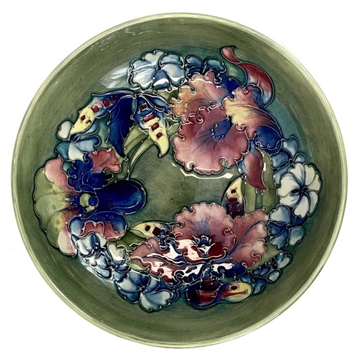 804 - A Moorcroft pottery bowl decorated in the Iris and Spring Flowers pattern. Height 7cm diameter 22cm.