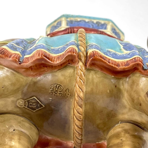 805 - A Royal Worcester porcelain vase designed by James Hadley. Modelled as an elephant with howdah. Impr... 