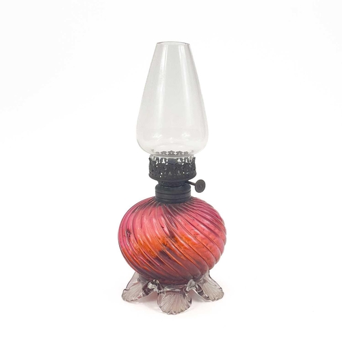 807 - A cut glass ship's decanter and stopper. Height 26cm, together with a Victorian cranberry glass smal... 