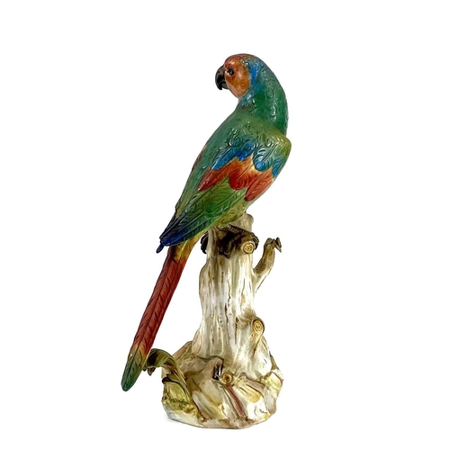 810 - A late 19th century Meissen model of a parrot perching on a branch. . Blue crossed sword marks and i... 