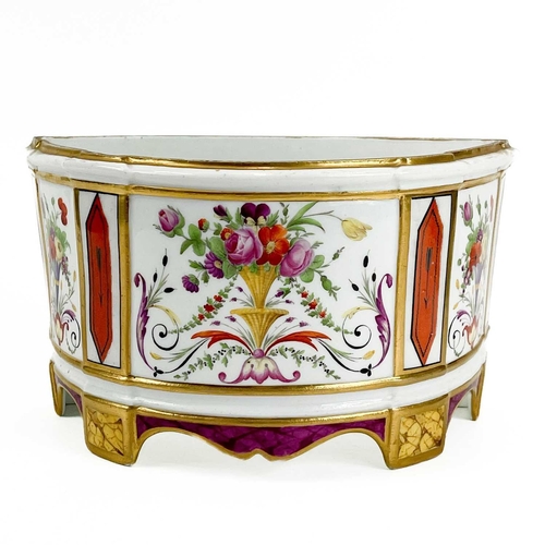 813 - A Paris porcelain bough pot. Circa 1820, polychrome painted with flower filled urns, width 24cm.