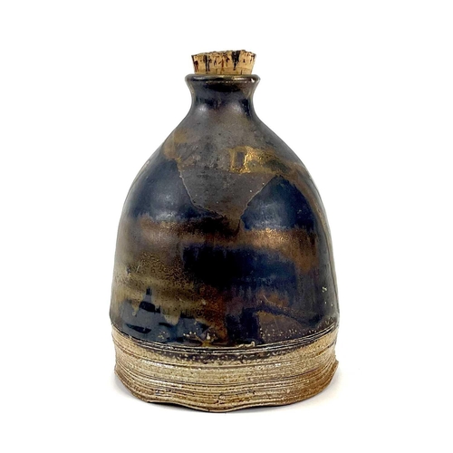 825 - Chris PRINDL A studio pottery cider jug in copper lustre glaze impressed seal mark, height 17cm.