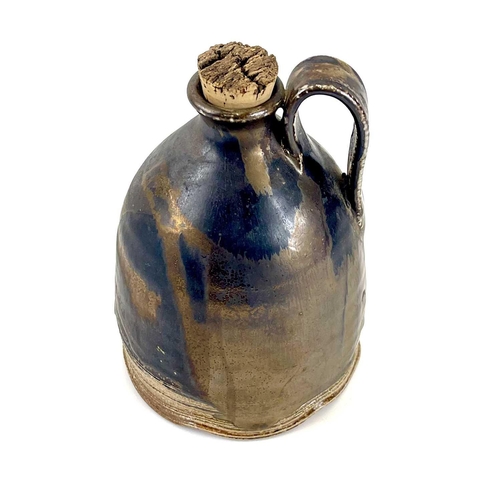 825 - Chris PRINDL A studio pottery cider jug in copper lustre glaze impressed seal mark, height 17cm.