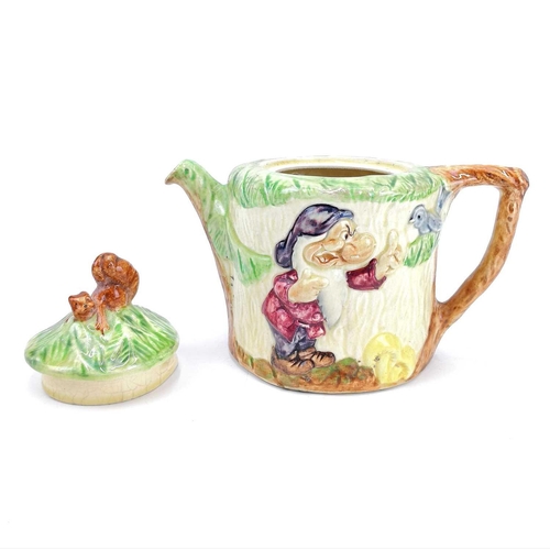 830 - A 1930s Wadeheath teapot. Decorated in relief with the figure of 'Grumpy' from the Disney film 'Snow... 