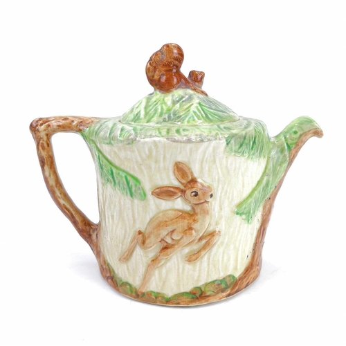 830 - A 1930s Wadeheath teapot. Decorated in relief with the figure of 'Grumpy' from the Disney film 'Snow... 