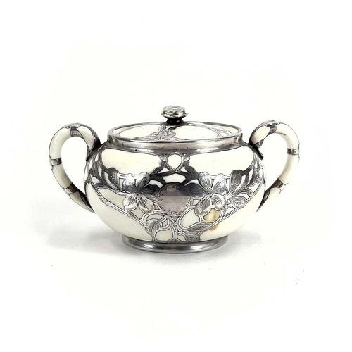 832 - A Royal Doulton white glazed silver overlaid three-piece tea service. The floral pierced and engrave... 