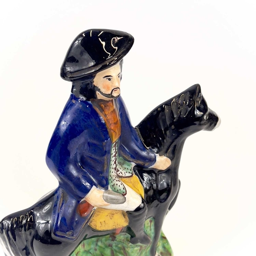 838 - A pair of Staffordshire figures of Dick Turpin and Tom King. Probably 1920s, height 31cm, together w... 