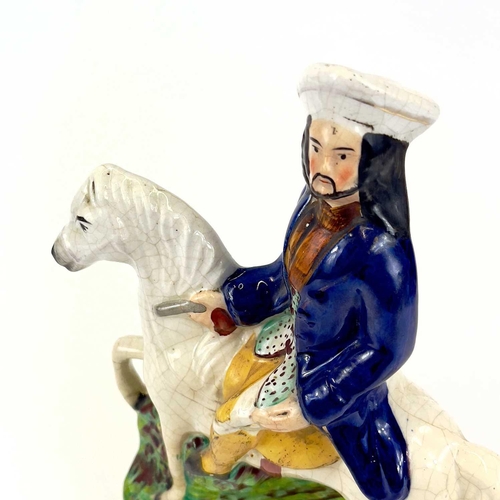 838 - A pair of Staffordshire figures of Dick Turpin and Tom King. Probably 1920s, height 31cm, together w... 