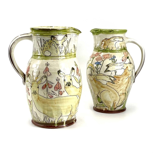 839 - Two Jennie HALE earthenware jugs. One decorated with hares amongst wildflowers, the other with deer ... 