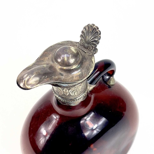 845 - A Victorian silver-mounted brown glass flask. Height 20.5cm. Together with two other similar flasks ... 