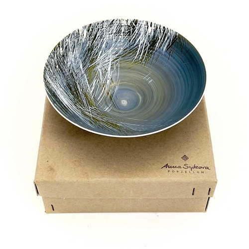 848 - An Anna Sykora studio porcelain bowl. The grey ground painted with stylised grasses, diameter 17cm, ... 