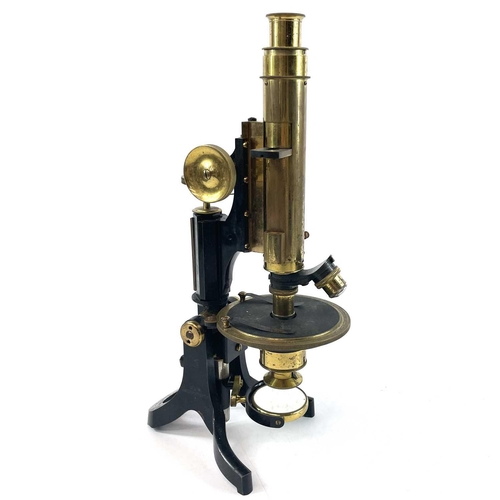 85 - A lacquered brass and brass Petrological microscope by J Swift & Sons early 20th century. Stamped U.... 