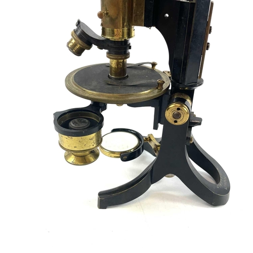 85 - A lacquered brass and brass Petrological microscope by J Swift & Sons early 20th century. Stamped U.... 