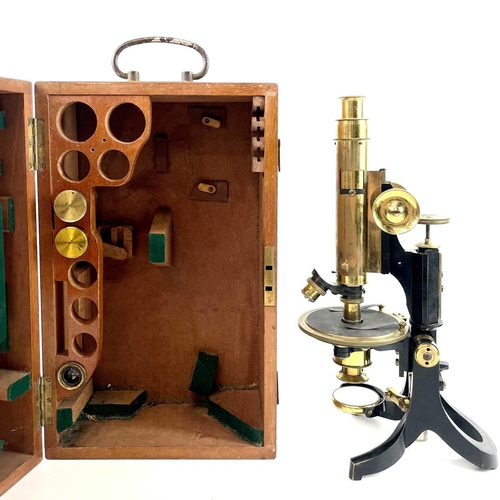 85 - A lacquered brass and brass Petrological microscope by J Swift & Sons early 20th century. Stamped U.... 