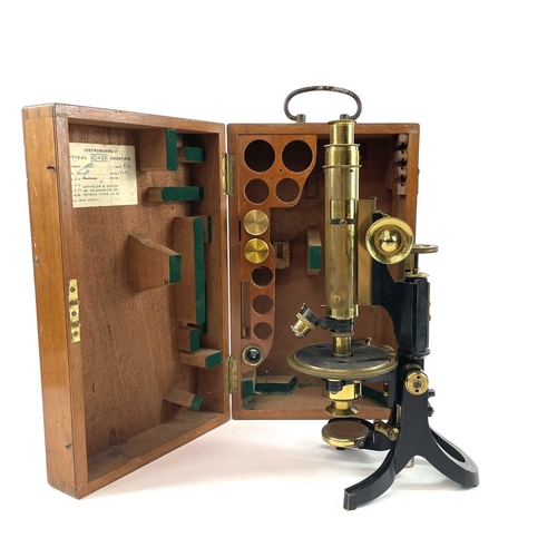 85 - A lacquered brass and brass Petrological microscope by J Swift & Sons early 20th century. Stamped U.... 