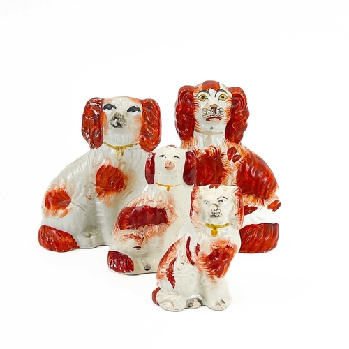 866 - A collection of six assorted Victorian Staffordshire spaniel ornaments. Height 28cm diminishing, tog... 