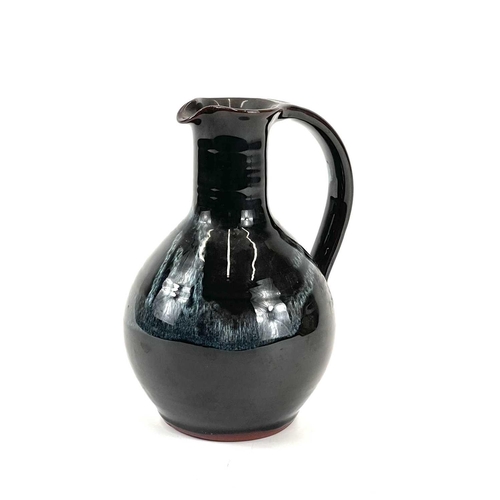 869 - John SWAN A studio pottery jug signed Lamorna to the base, height 17.5cm.