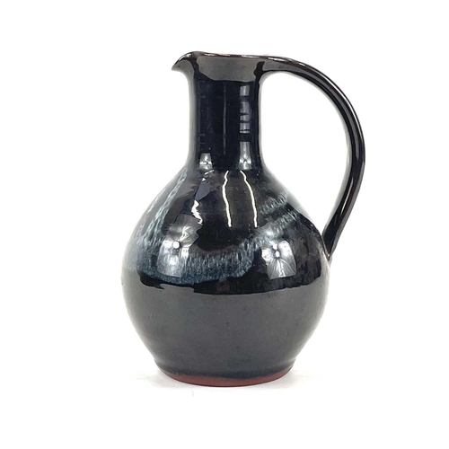 869 - John SWAN A studio pottery jug signed Lamorna to the base, height 17.5cm.