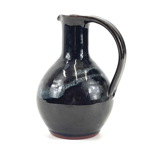 869 - John SWAN A studio pottery jug signed Lamorna to the base, height 17.5cm.