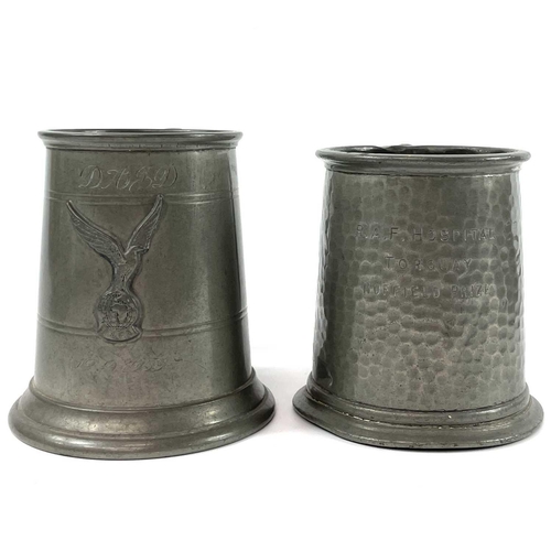 87 - A pair of Continental pewter pricket candlesticks. Late 19th century, with shaped rectangular bases,... 