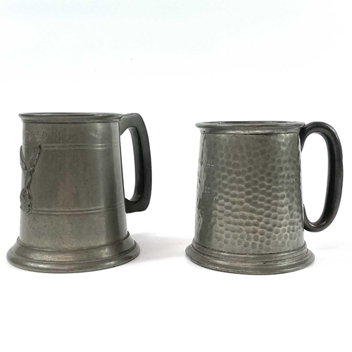 87 - A pair of Continental pewter pricket candlesticks. Late 19th century, with shaped rectangular bases,... 