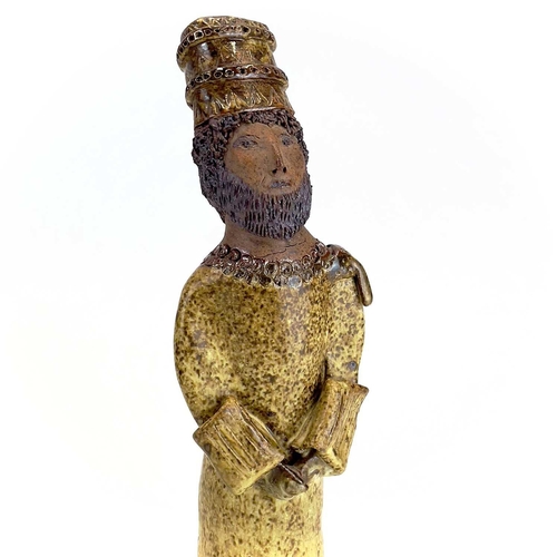 876 - A studio pottery figure of a King. Indistinctly inscribed Cornish? height 33cm.