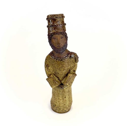 876 - A studio pottery figure of a King. Indistinctly inscribed Cornish? height 33cm.