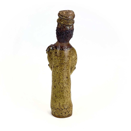 876 - A studio pottery figure of a King. Indistinctly inscribed Cornish? height 33cm.