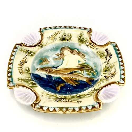 878 - A Majolica plate, French circa 1880. Relief decorated a mermaid and flying fish within a border of c... 