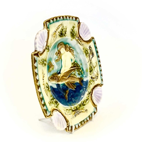 878 - A Majolica plate, French circa 1880. Relief decorated a mermaid and flying fish within a border of c... 