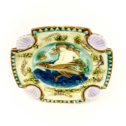 878 - A Majolica plate, French circa 1880. Relief decorated a mermaid and flying fish within a border of c... 