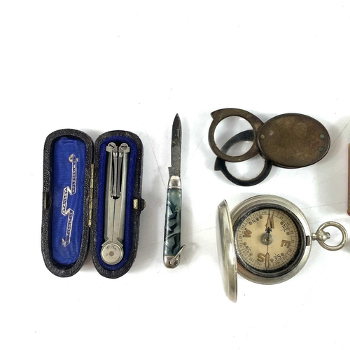 88 - A Stanley nickel folding compass, cased. Together with a cased pocket compass, a Mickey Mouse 9.5mm ... 